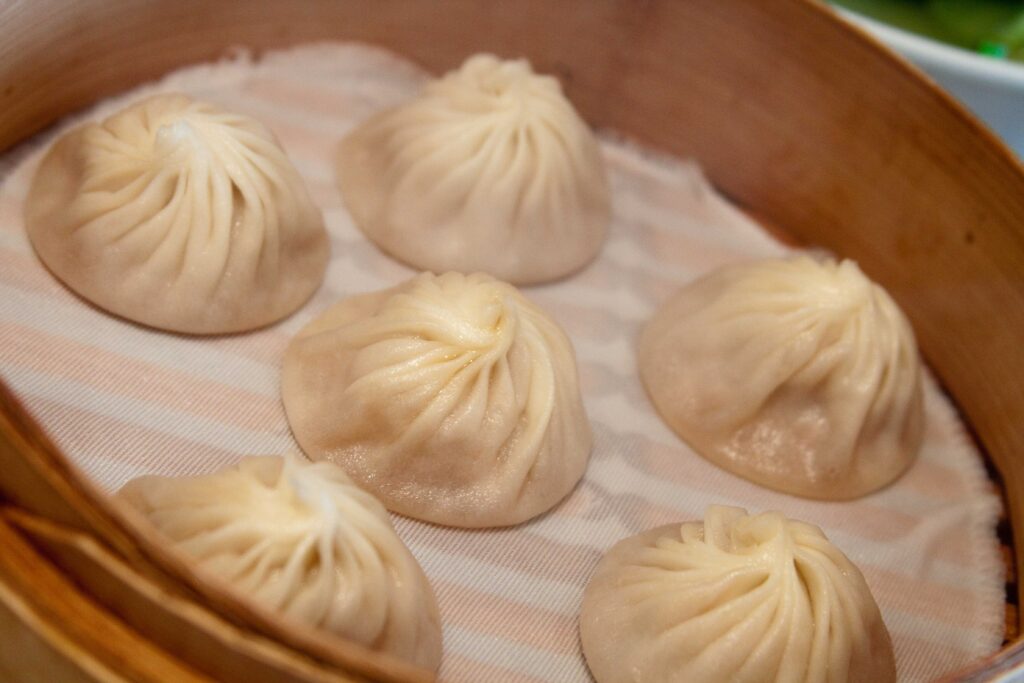 Xiaolongbao soup dumplings in a steamer